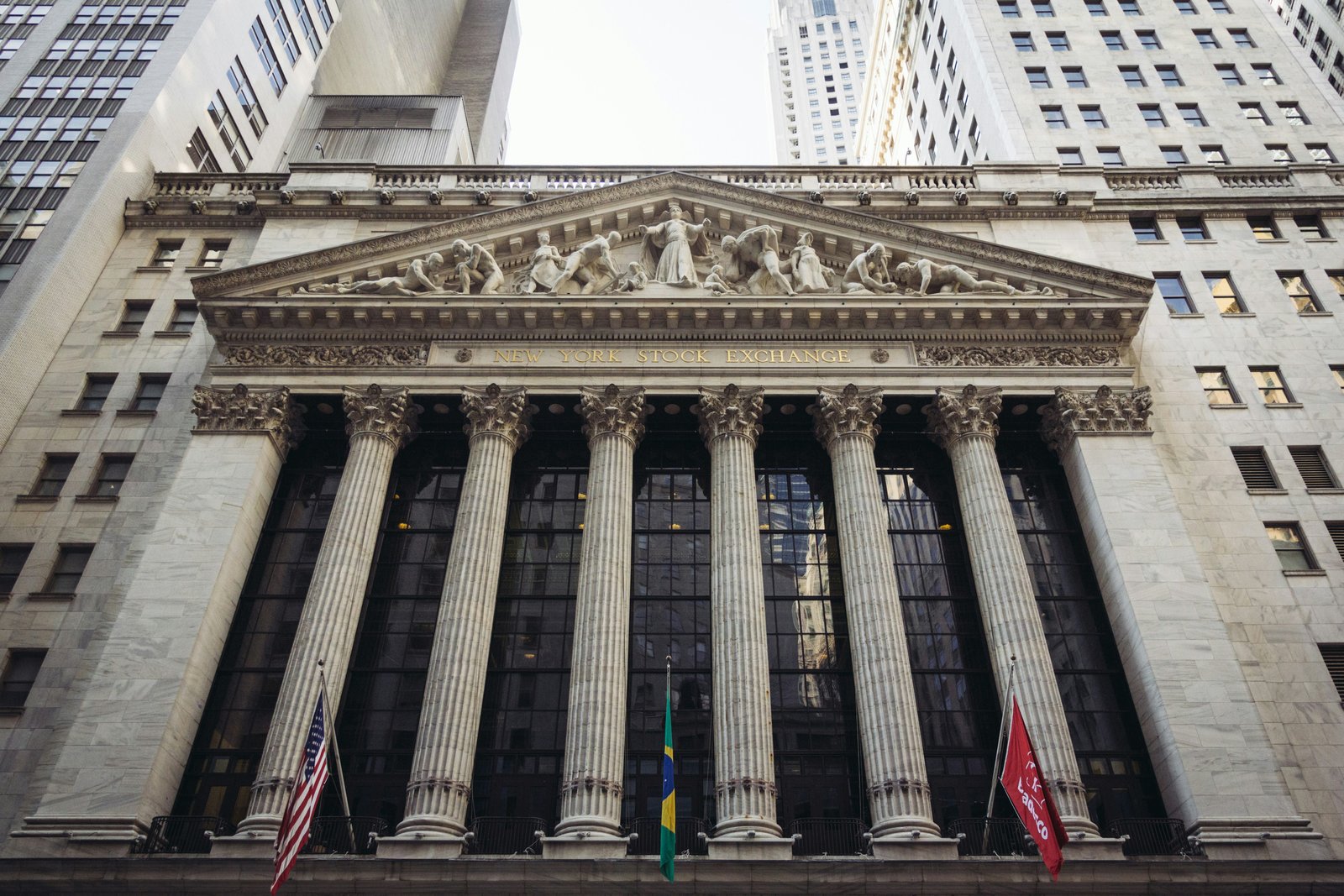 The New York Stock Exchange facade with its columns and flags