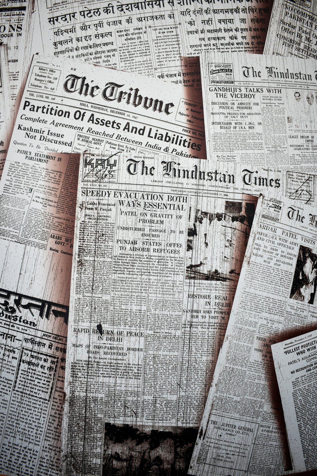 A collage of vintage newspapers with historic front-page headlines
